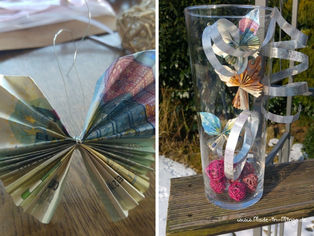Geldschein als Schmetterling gefaltet und in Vase dekoriert