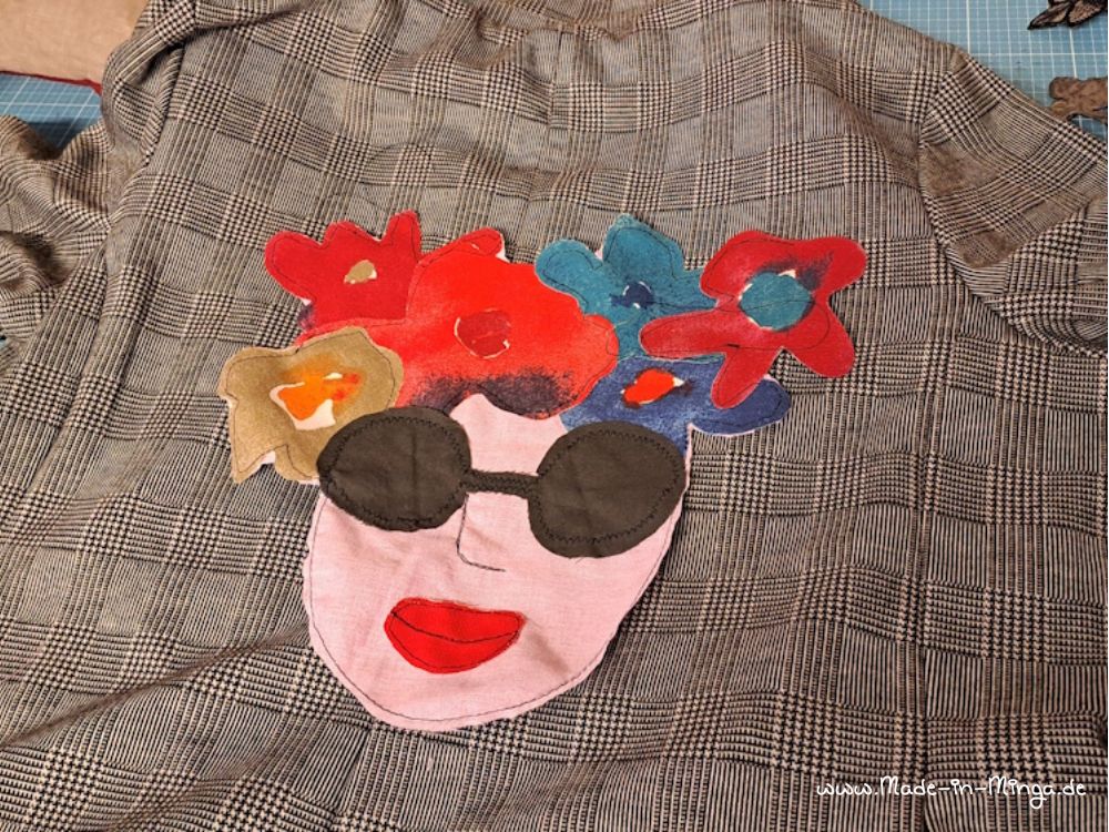 Patch auf Jacke nähen